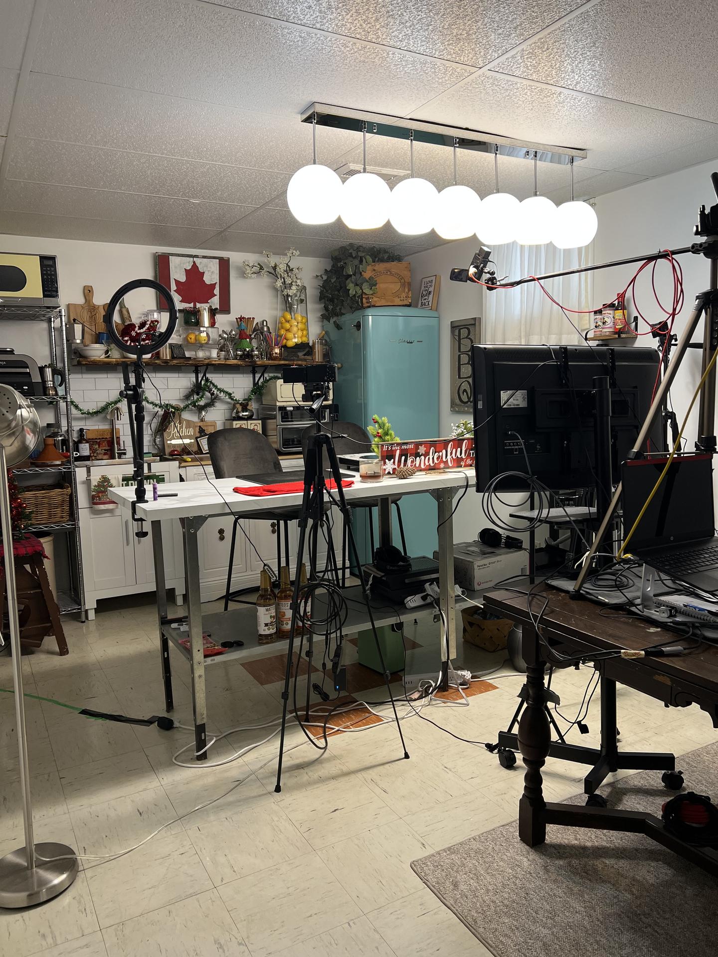The BBQ Bunker studio interior showing the full production setup with cameras, lights, and cooking area